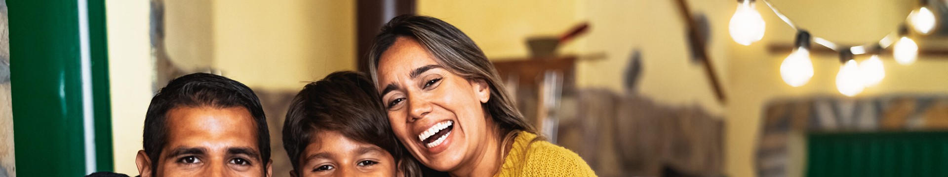 Happy Hispanic family enjoying holidays together at home